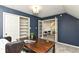 Stylish office space features an open closet and double french doors leading to the hall at 14728 Adios Pass, Carmel, IN 46032