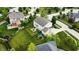 Aerial view of backyard featuring a patio, playset, and lush lawn at 1476 Anon Ct, Greenwood, IN 46143