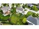 Aerial view of backyard featuring a patio, playset, and lush lawn at 1476 Anon Ct, Greenwood, IN 46143