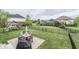 Spacious fenced backyard with patio, table, and play area at 1476 Anon Ct, Greenwood, IN 46143