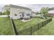 Large fenced backyard with patio, dining table, and playset at 1476 Anon Ct, Greenwood, IN 46143