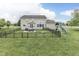 Spacious fenced backyard with patio, table, and a ' playset at 1476 Anon Ct, Greenwood, IN 46143