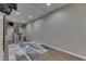Finished basement with a bar area, mini-fridge, and wood-look flooring, offering a stylish entertainment space at 1476 Anon Ct, Greenwood, IN 46143