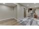 Finished basement features a wet bar, mini-fridge and recessed lighting, with a sliding barn door at 1476 Anon Ct, Greenwood, IN 46143