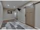 Finished basement with light, neutral colors and modern gray carpet at 1476 Anon Ct, Greenwood, IN 46143