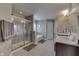 Bright bathroom features a glass-enclosed shower, soaking tub, double sink vanity, and tiled flooring at 1476 Anon Ct, Greenwood, IN 46143