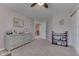 Bedroom with neutral walls, carpet flooring, a light gray dresser, mirror and slider door at 1476 Anon Ct, Greenwood, IN 46143