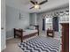 Bedroom with wood frame bed, gray walls, carpet flooring, blue and white chevron patterned rug at 1476 Anon Ct, Greenwood, IN 46143