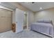 Bedroom with neutral paint, carpet, closet and access to an additional room at 1476 Anon Ct, Greenwood, IN 46143
