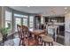 Inviting dining area with wood floors, a table, and access to the backyard at 1476 Anon Ct, Greenwood, IN 46143