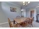 Bright dining room featuring a wood table, chandelier, and neutral paint at 1476 Anon Ct, Greenwood, IN 46143