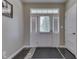 Bright entryway with sidelights, hardwood floors, and a neutral color palette at 1476 Anon Ct, Greenwood, IN 46143