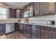 Updated kitchen featuring granite countertops, stainless steel appliances, and dark cabinetry at 1476 Anon Ct, Greenwood, IN 46143