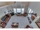 Aerial view of a living room with high ceilings, fireplace, and dining area at 1476 Anon Ct, Greenwood, IN 46143