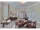 Well-appointed home office with built-in storage, a stylish desk, and French doors at 1476 Anon Ct, Greenwood, IN 46143