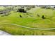 Scenic view of a walking path meandering through open green spaces and mature trees in a neighborhood park at 1476 Anon Ct, Greenwood, IN 46143