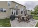Back patio with dining table, grill, and seating area at 1476 Anon Ct, Greenwood, IN 46143