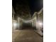 Inviting brick-paved backyard alleyway is illuminated with overhead string lights, creating a warm, cozy atmosphere at 1512 Bellefontaine St, Indianapolis, IN 46202