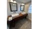 Rustic bathroom featuring a custom wood vanity with dual vessel sinks and stylish fixtures at 1512 Bellefontaine St, Indianapolis, IN 46202
