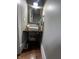 Charming powder room with a unique repurposed vintage sewing machine as a sink stand at 1512 Bellefontaine St, Indianapolis, IN 46202