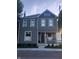 Charming two-story home with gray siding, white trim, and a welcoming front porch at 1512 Bellefontaine St, Indianapolis, IN 46202