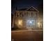 Charming two-story home at night with lit windows and welcoming porch light at 1512 Bellefontaine St, Indianapolis, IN 46202