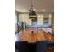 Bright kitchen features a large wooden island with seating and pendant lighting at 1512 Bellefontaine St, Indianapolis, IN 46202