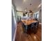 Spacious kitchen features a large wooden island with seating, stainless steel appliances, and subway tile backsplash at 1512 Bellefontaine St, Indianapolis, IN 46202