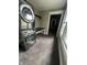 Laundry room with stacked washer/dryer and natural light from a bright window at 1512 Bellefontaine St, Indianapolis, IN 46202