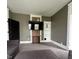 Living room featuring a mounted television, brick accent wall and classic wood trim at 1512 Bellefontaine St, Indianapolis, IN 46202