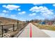 Paved walking path adjacent to community park and wooded hill, perfect for outdoor recreation at 1512 Bellefontaine St, Indianapolis, IN 46202