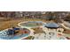 Aerial view of community playground featuring play structures, seating, splashpad, and pathways at 1512 Bellefontaine St, Indianapolis, IN 46202
