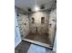 Spacious glass shower featuring stylish tilework, dual shower heads, and built-in shelving at 1512 Bellefontaine St, Indianapolis, IN 46202