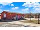 Community splashpad with seating, murals and disabled parking on a clear, sunny day at 1512 Bellefontaine St, Indianapolis, IN 46202