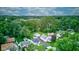 An aerial view captures the neighborhood's landscape, revealing a mix of lush greenery and tidy residential homes at 1517 Wallace Ave, Indianapolis, IN 46201