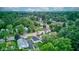 A bird's eye view of a neighborhood's mature trees and manicured lawns adds to the tranquil setting of the houses at 1517 Wallace Ave, Indianapolis, IN 46201