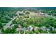 Expansive aerial shot showcases the beautiful neighborhood with neatly arranged homes, lush trees, and open green spaces at 1517 Wallace Ave, Indianapolis, IN 46201