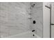 Stylish bathroom with marble tile shower, built-in shelves, and updated fixtures at 1517 Wallace Ave, Indianapolis, IN 46201