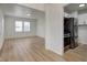 Open concept living and kitchen area with natural light and modern stainless steel appliances at 1517 Wallace Ave, Indianapolis, IN 46201