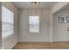 Bright living room showcasing neutral walls, wood-look floors, and natural light through two windows at 1517 Wallace Ave, Indianapolis, IN 46201