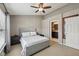 Relaxing bedroom featuring a comfortable bed, side tables, and easy access to an ensuite bathroom at 15369 Mystic Rock Dr, Carmel, IN 46033