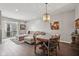 Elegant dining room with a wood table, access to the living room, and a bright, open layout at 15369 Mystic Rock Dr, Carmel, IN 46033