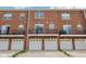 Exterior shot of a brick apartment complex with second floor balconies and a one car garage at 15369 Mystic Rock Dr, Carmel, IN 46033