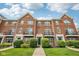 Charming brick townhouse featuring well-manicured landscaping and a classic architectural design at 15369 Mystic Rock Dr, Carmel, IN 46033