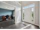 Inviting foyer with hardwood floors, a bright entryway, and a glimpse into the home office at 15369 Mystic Rock Dr, Carmel, IN 46033
