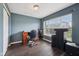 Office with dark wood floors and a large window at 15369 Mystic Rock Dr, Carmel, IN 46033