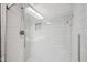 Modern shower with subway tile and glass door at 15369 Mystic Rock Dr, Carmel, IN 46033