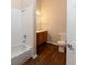 This bathroom showcases wood-look floors and a shower-tub combo at 16628 Brownstone Ct, Westfield, IN 46074