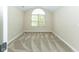 Neutral bedroom with a vaulted ceiling and a large window overlooking the landscaped outdoors at 16628 Brownstone Ct, Westfield, IN 46074