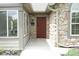 Close-up of the front entrance highlighting the stone accents and attractive front door at 16628 Brownstone Ct, Westfield, IN 46074